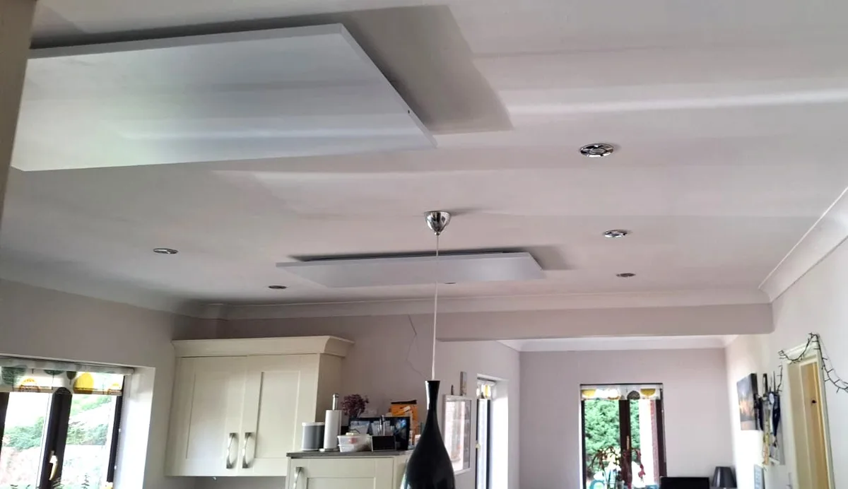 PowerBoard surface panels spaced across the ceiling of an open plan kitchen and dining room.